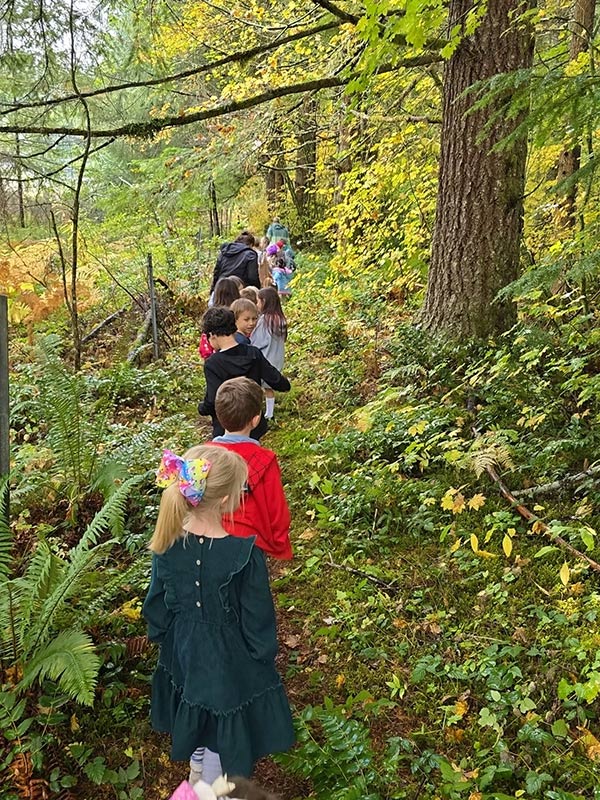 Hiking to our sit spot for writing