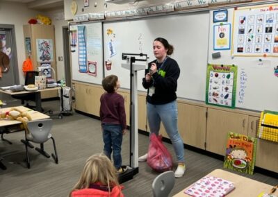 Students weighed their garbage bags after cleaning up the campus