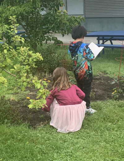 Students record observations in library notebooks